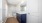 bathroom with a large mirror and walk-in shower