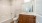 bathroom with a large mirror and walk-in shower